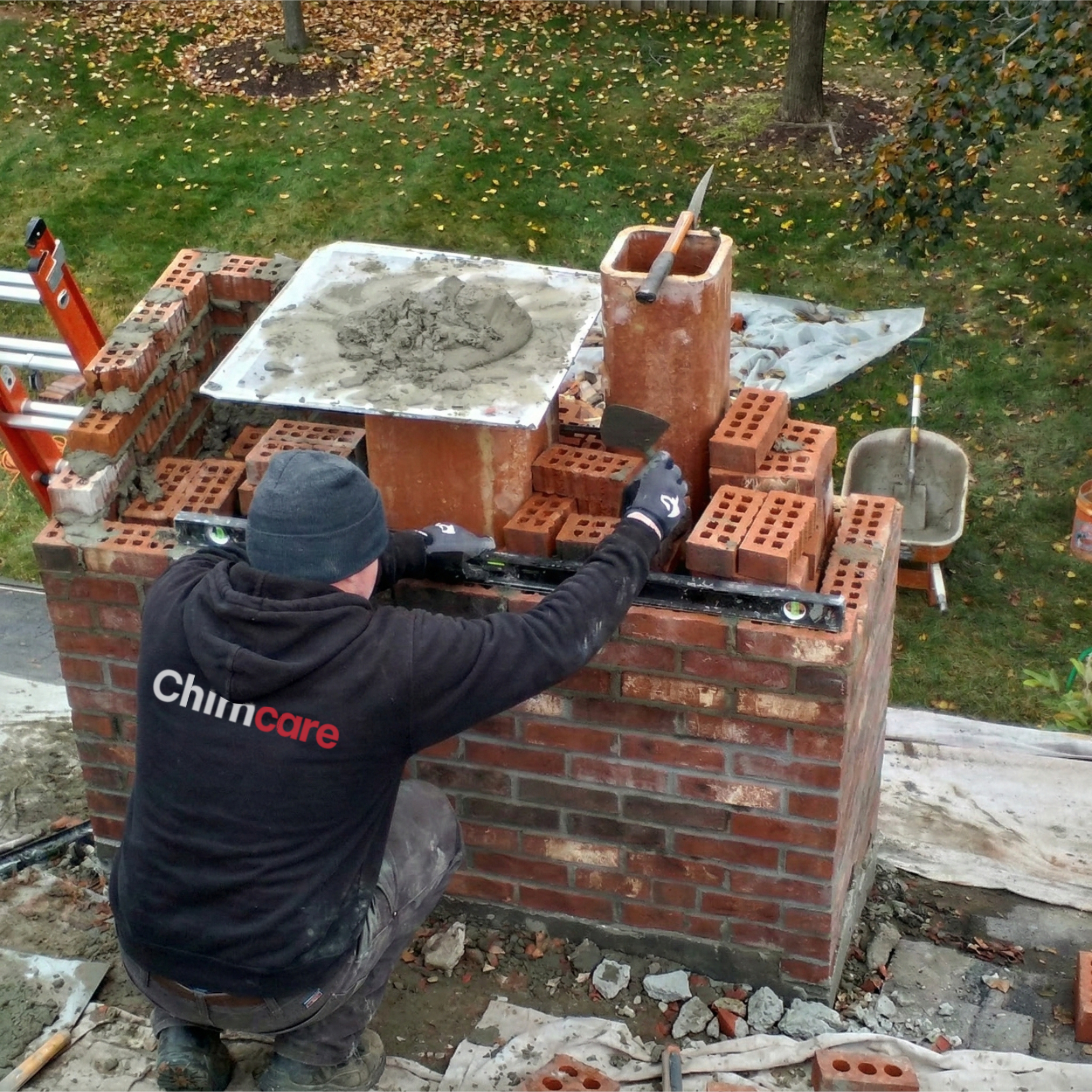 Chimcare mason repairing a brick chimney Chimcare mason repairing a brick chimney