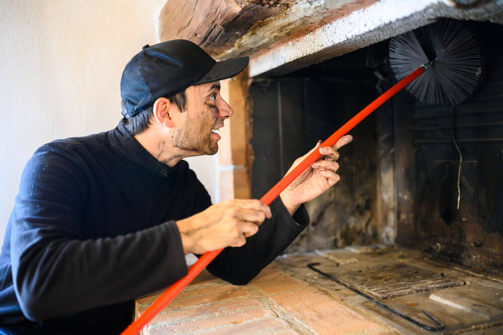 Chimcare technician performing Oregon chimney sweep service